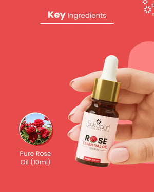 Hand holding 10ml bottle of pure rose essential oil with dropper, key ingredient highlighted