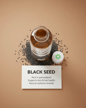Black seed oil bottle with scattered seeds, rich in antioxidants for skin and hair wellness
