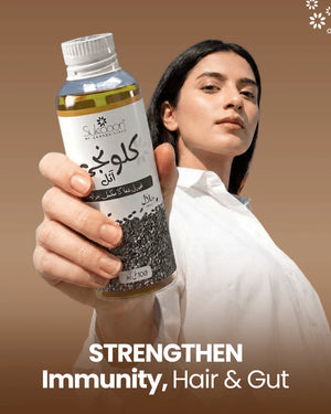 Woman holding bottle of natural black seed oil for immunity, hair & gut health, Halal certified