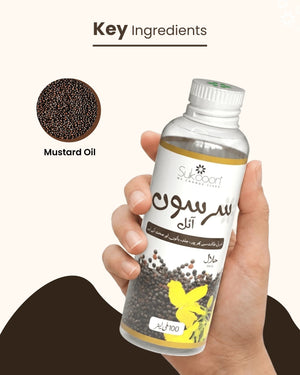 Hand holding bottle of pure mustard oil with key ingredients shown, natural wellness product for hair and skin care