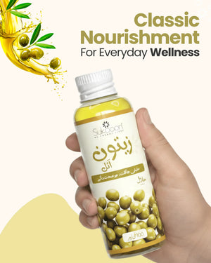 Hand holding bottle of pure olive oil for everyday wellness, with fresh olives and splash design