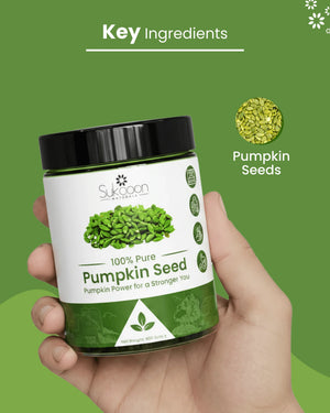 Hand holding 100% pure pumpkin seed jar, natural health supplement for wellness
