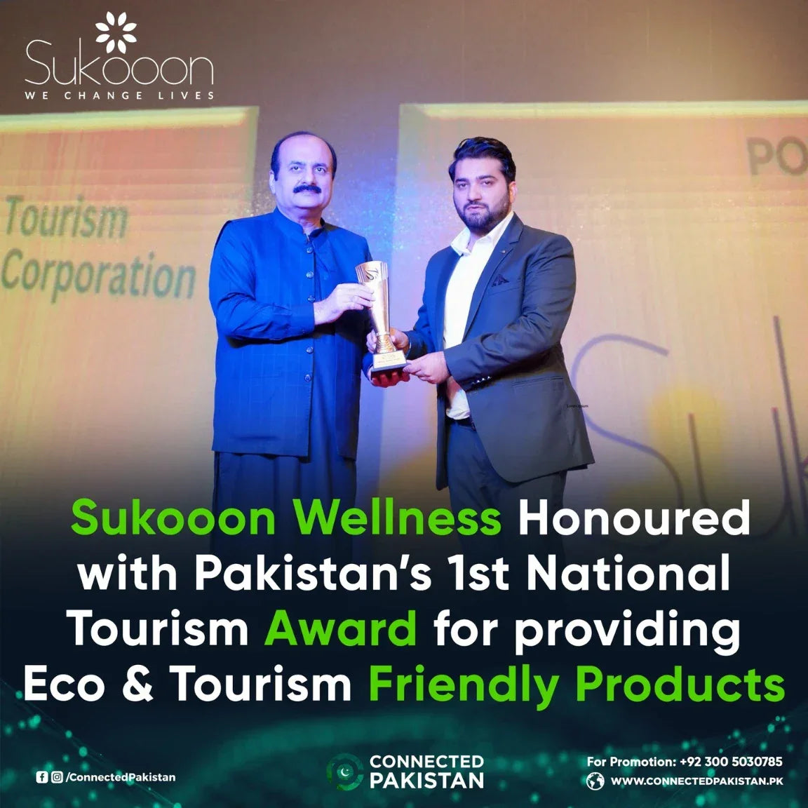 Two men receiving Pakistan's National Tourism Award for eco-friendly wellness products on stage.