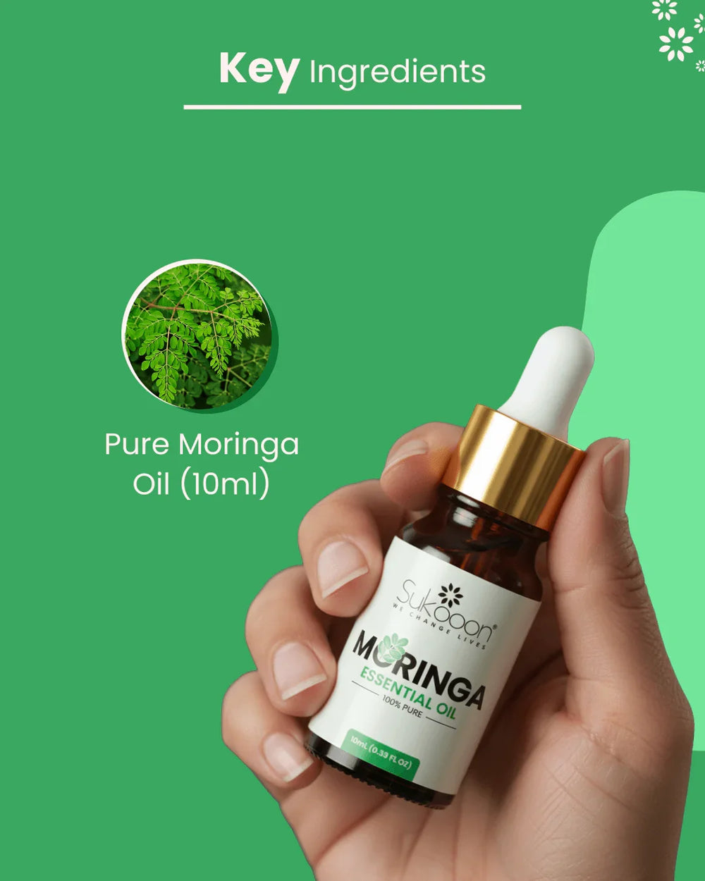 Hand holding 10ml bottle of pure moringa essential oil with dropper, green background highlighting key ingredients