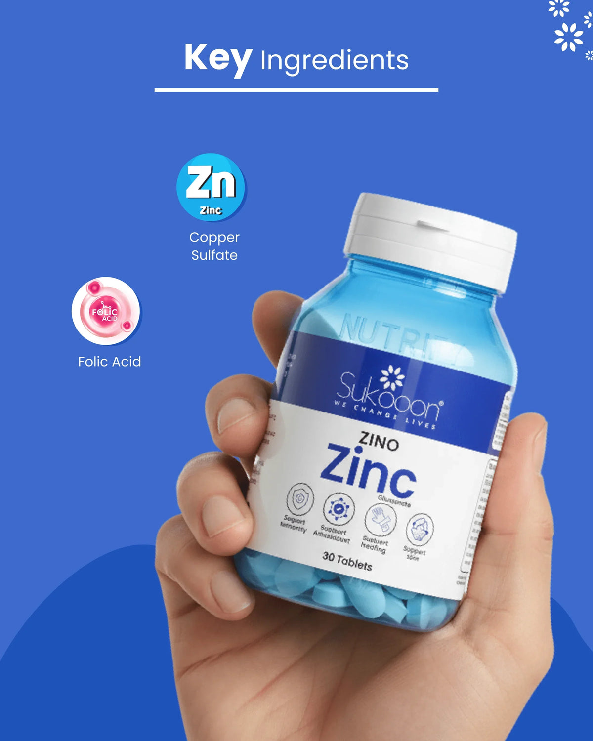 Hand holding Sukooon Zino Zinc supplement bottle with key ingredients Zinc, Copper Sulfate, Folic Acid highlighted